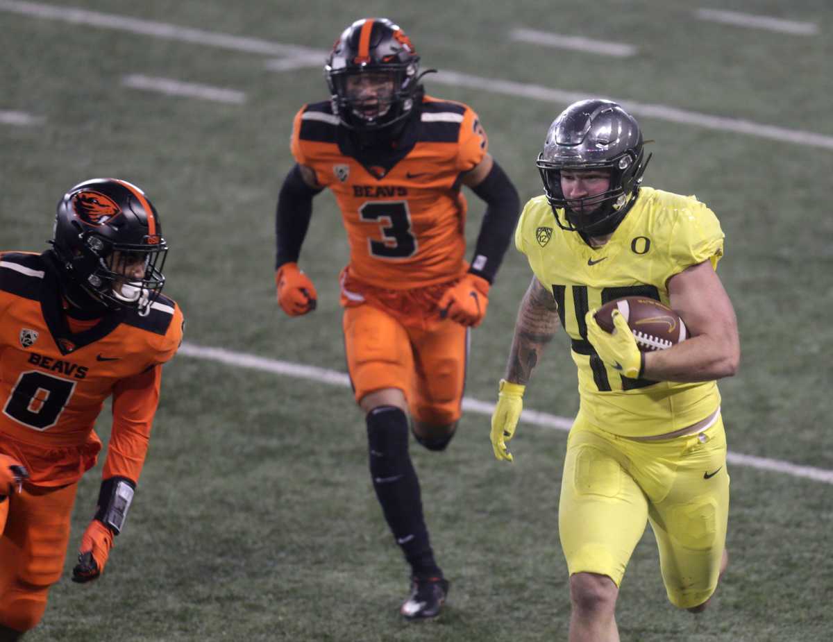 Hunter Kampmoyer (48) runs against Oregon State in a regular season game at Reser Stadium in Corvallis, Oregon, on November 28, 2020. 